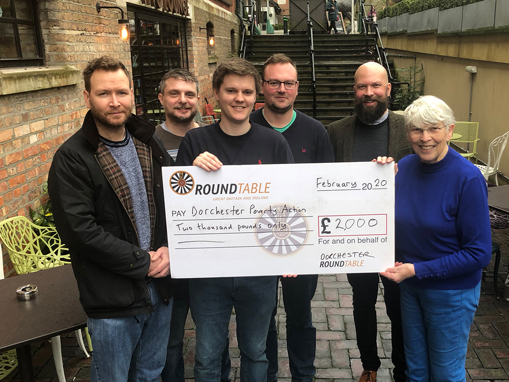 Dorchester Round Table members presenting a £2,000 donation to Dorchester Poverty Action